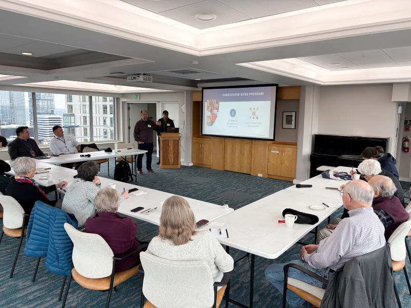 Photo of two Harborview Bond Program team members (Ted and Melvin) presenting at a First Hill neighborhood meeting